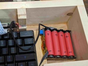 a homemade battery pack with four red lithium-ion batteries